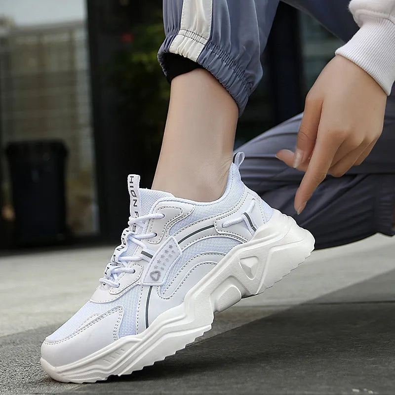 Women's white casual sports shoes with thick sole, mesh upper, buckle detail and round toe