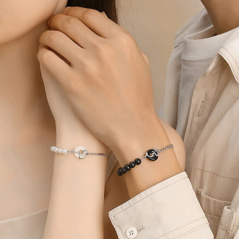 925 sterling silver couple bracelet with snake charm, obsidian pearl, and safe buckle in new Chinese style.