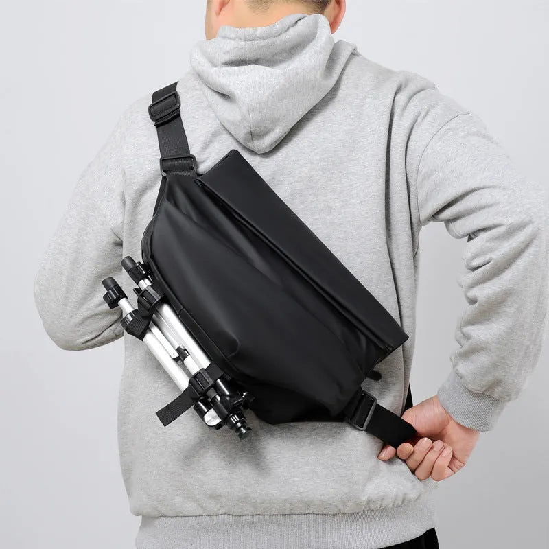 Grey PU men's crossbody sling backpack with a phone pocket on a mannequin.
