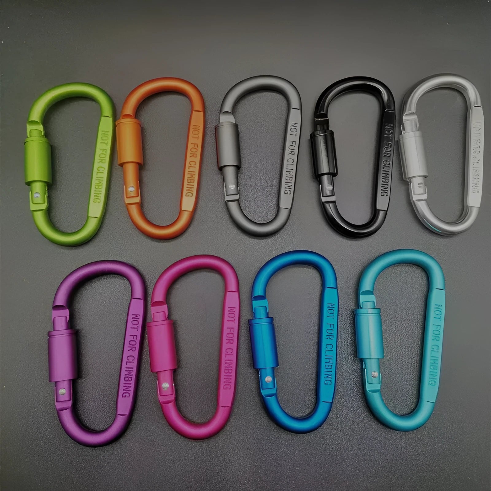 D-type aluminium locking climbing carabiner with screwgate, shown in a bright colour on a grey background.