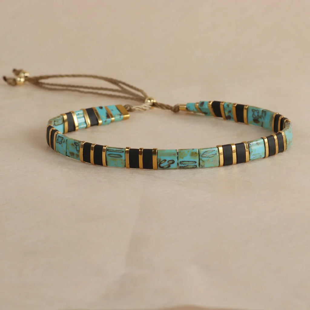 Geometric glass beaded bracelet in milky white, black, green, blue, or red with round elements