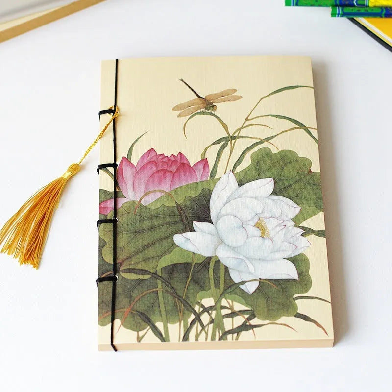 A5 antique wire-bound notebook with retro painting cover, thread binding, and black tassels.