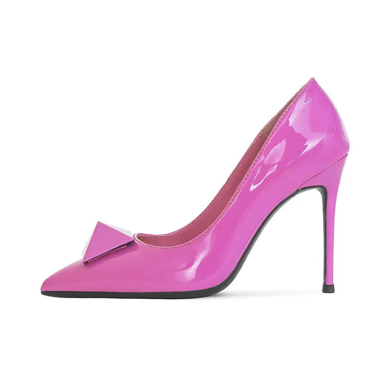 Women's pink patent leather stiletto heels with pointed toe and buckle fastening on rubber sole