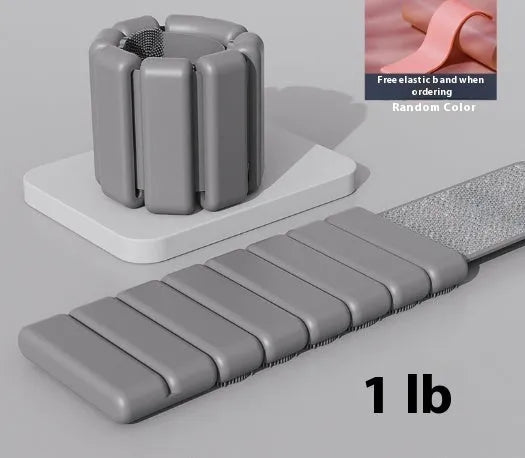 Silicone Velcro fitness wrist weight bracelet in black, shown on a wrist, available in 1lb and 2lb options.