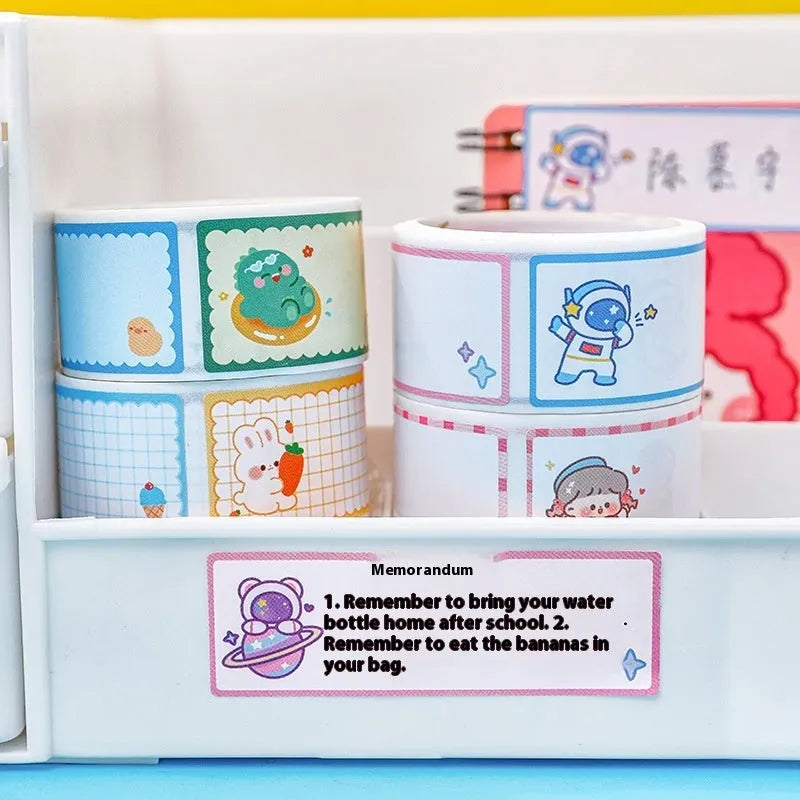 Roll of cartoon tape name labels showing dinosaur, astronaut, rabbit, and girl design options