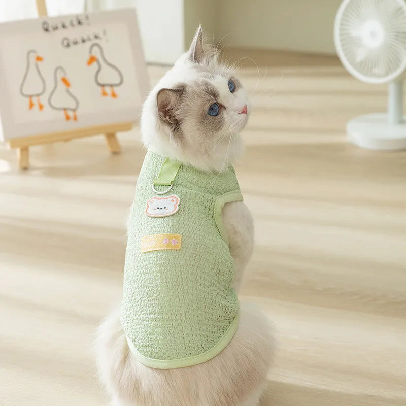 Green knitted cat clothes with hollowed-out design and cartoon bear patch decoration