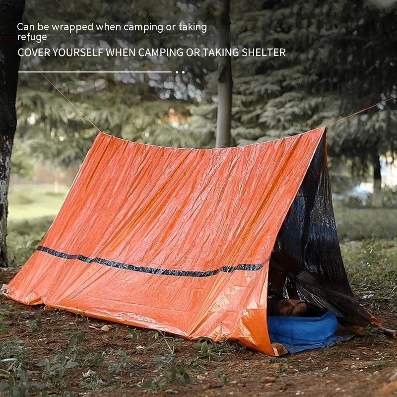 Emergency disaster relief tent kit with orange sleeping bag and whistle survival gear