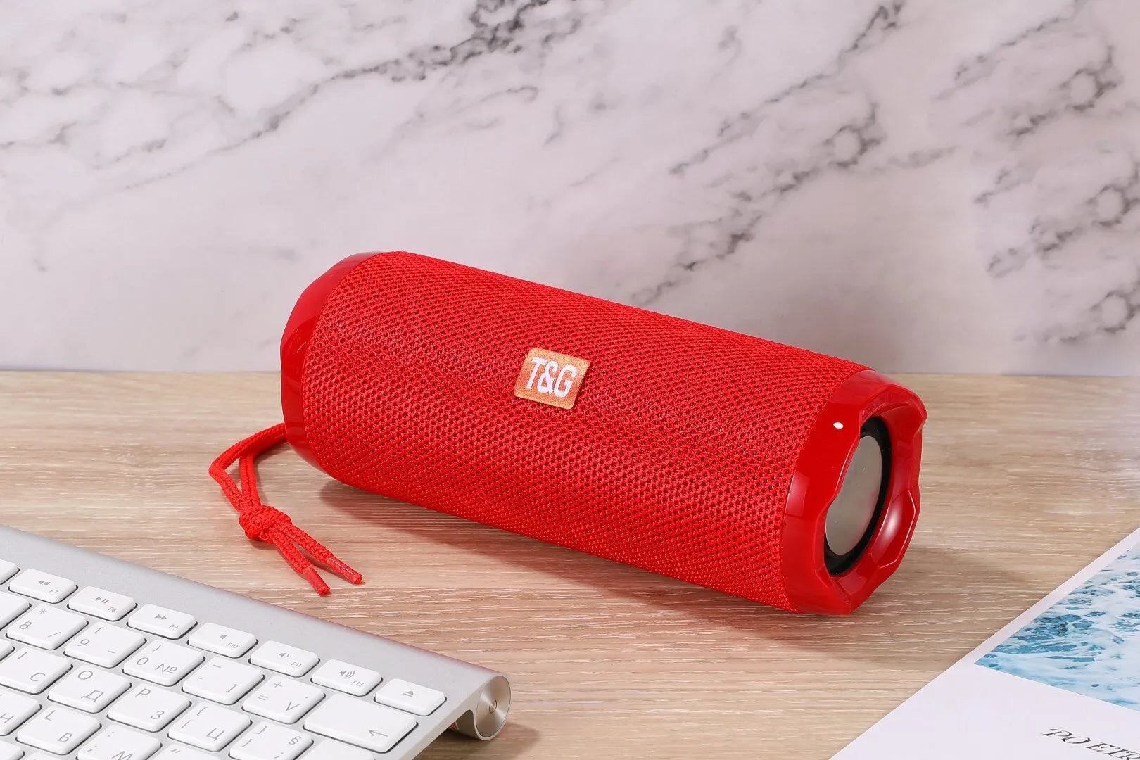 Fabric portable Bluetooth speaker with integrated card holder shown in multiple colour options.