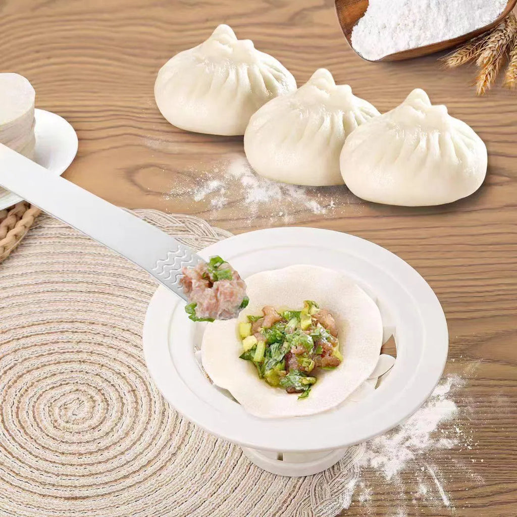 Set of four black ABS plastic steamed bun moulds with ergonomic handles for shaping baozi, dumplings and shaomai