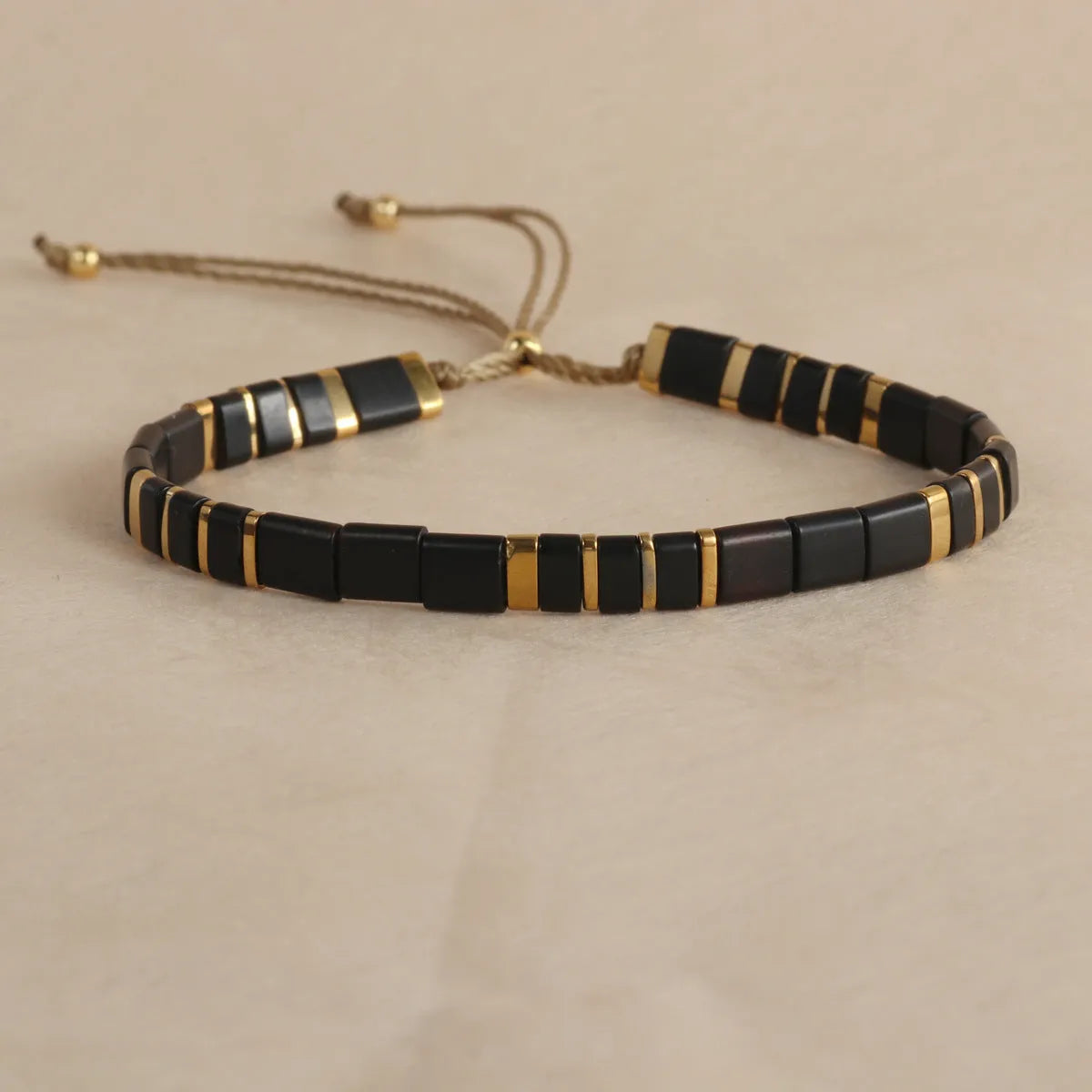 Geometric glass beaded bracelet in milky white, black, green, blue, or red with round elements