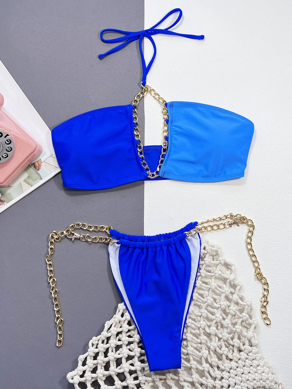 Solid blue women's nylon bikini swimsuit laid flat showing two-piece design