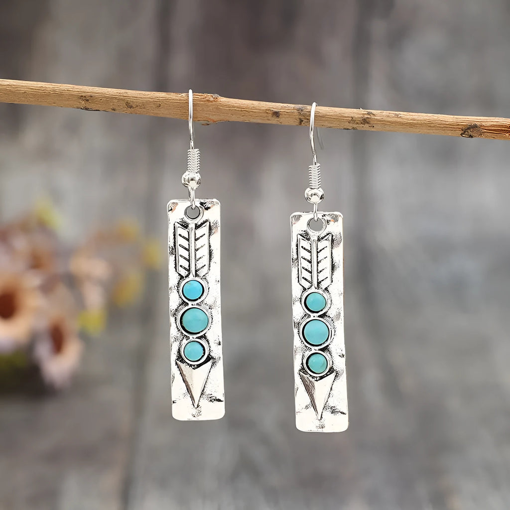 Silver-coloured geometric earrings with turquoise inlay measuring 20-24cm long