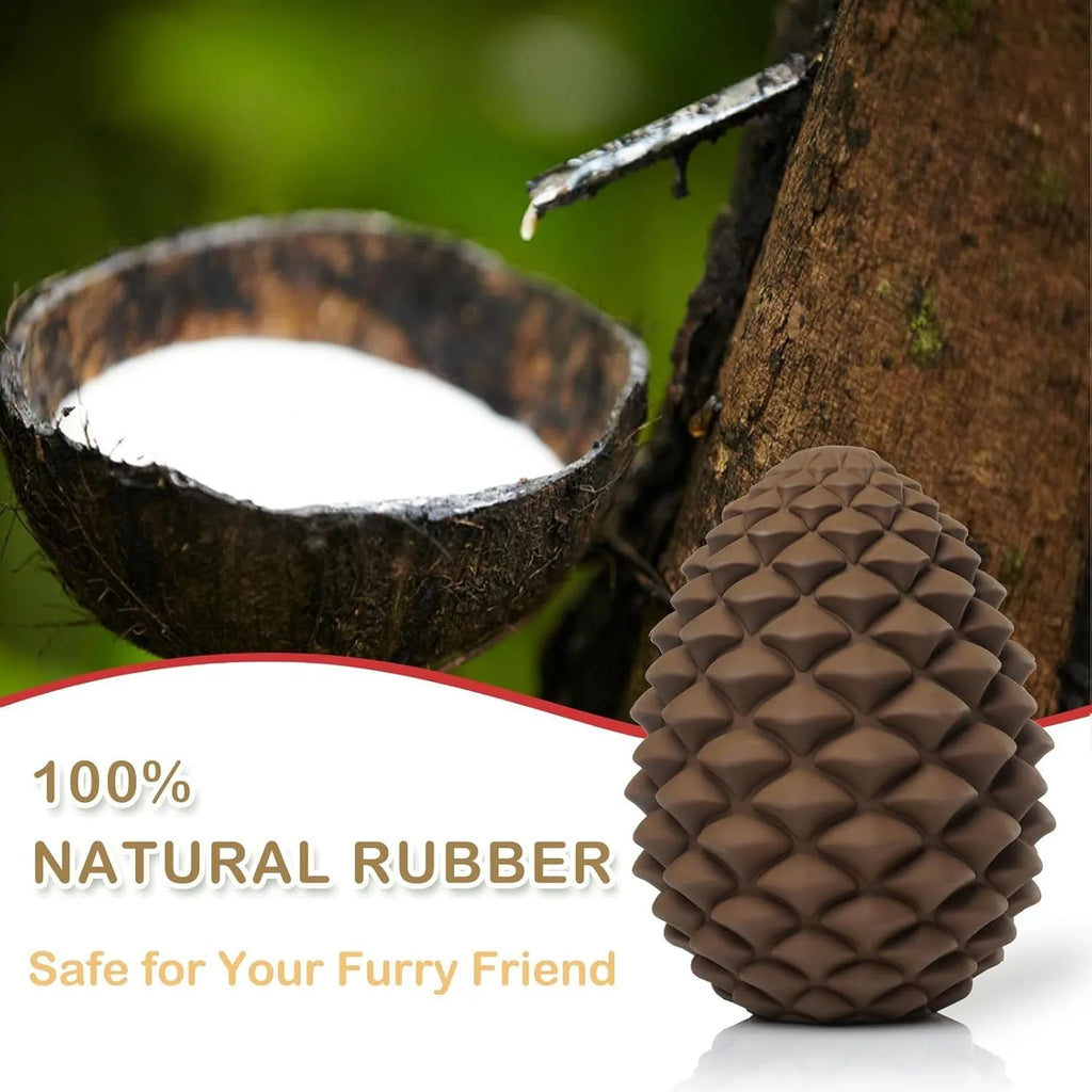 Yellow pine cone shaped natural rubber dog chew toy with treat dispenser hole.