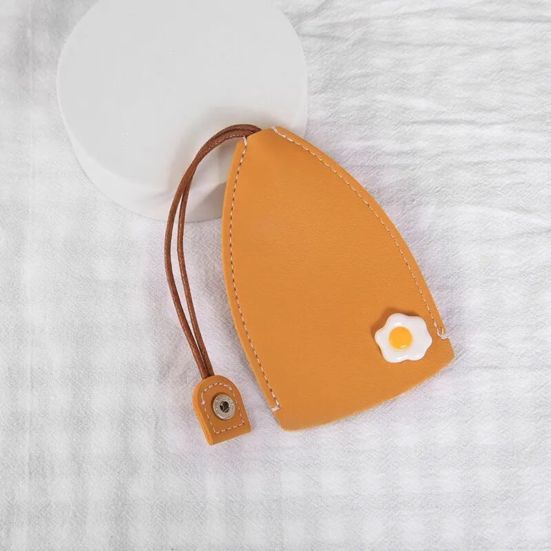 Colourful cartoon pull-out key case made from PU leather showing design options