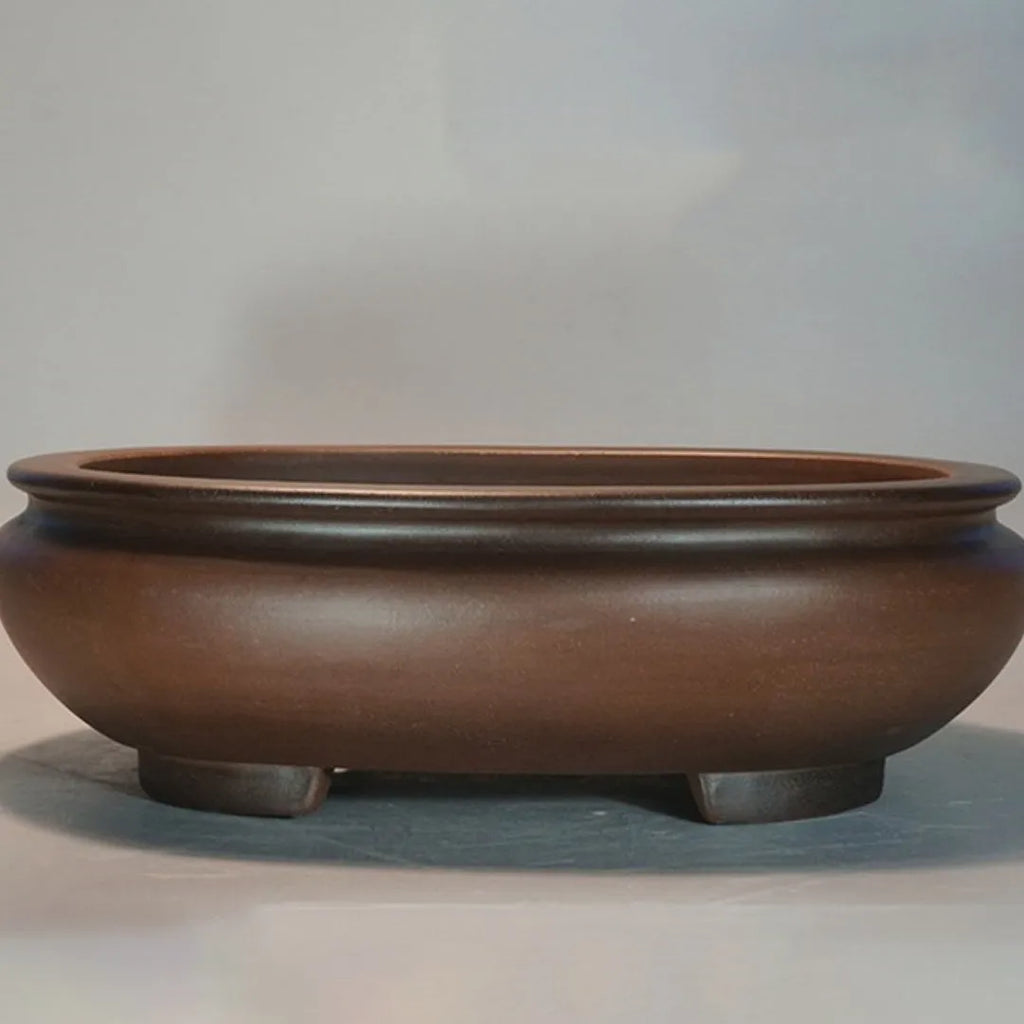 Handmade purple clay desktop flowerpot with classical design for indoor plants.