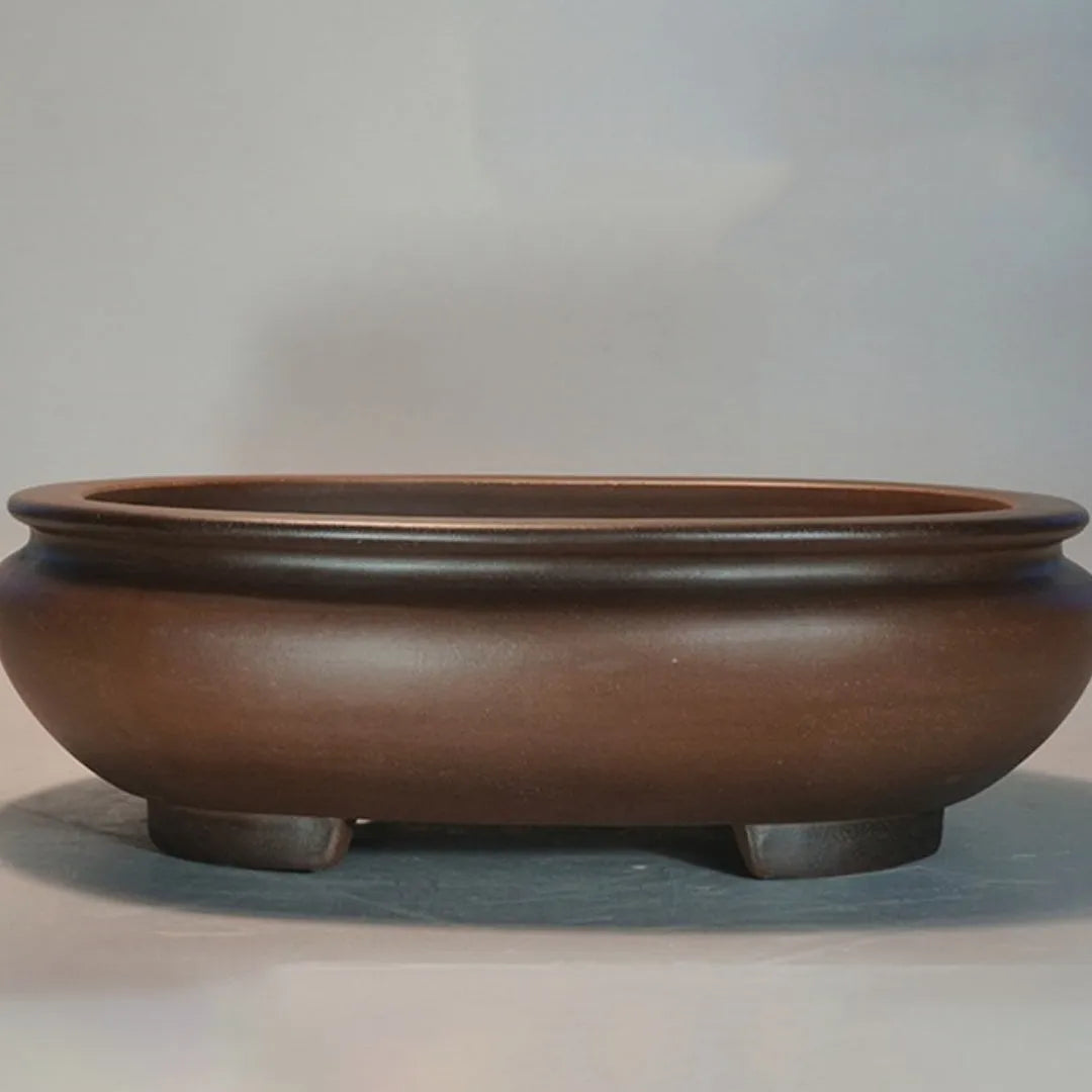 Handmade purple clay desktop flowerpot with classical design for indoor plants.