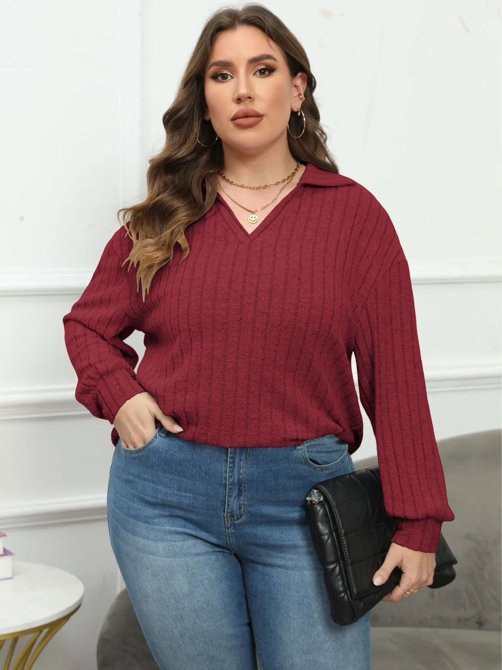 Woman wearing a gray plus size polo collar fleece shirt with lantern sleeves