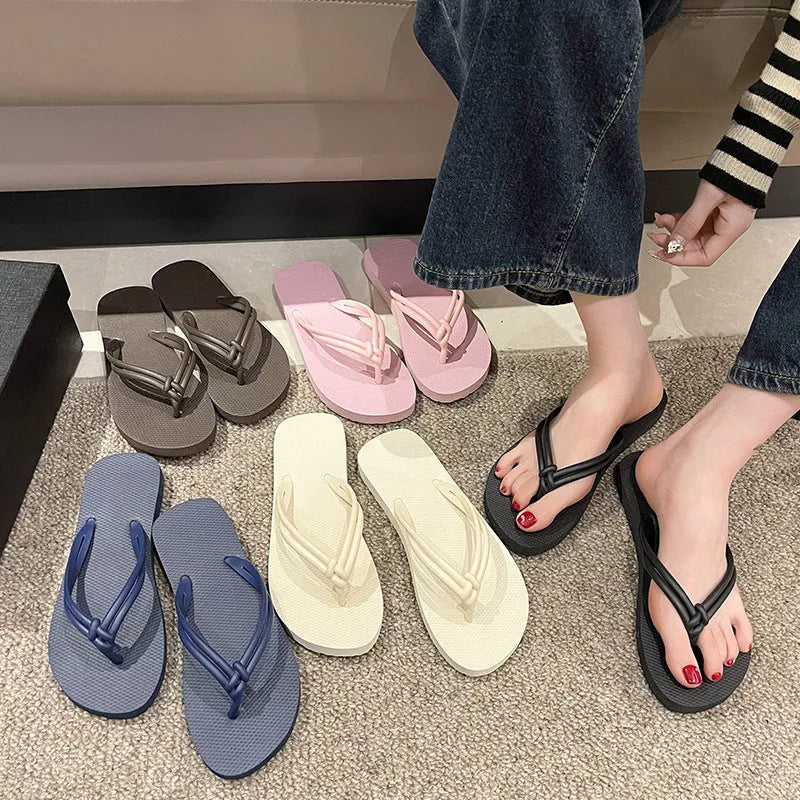 Women's pink flip flops with toe-covering design and non-slip PVC sole for summer outdoor wear