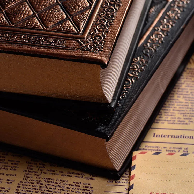 Embossed faux leather notepad showing three-dimensional cover design in bronze and black gold colour options