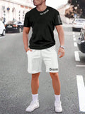 Man wearing a grey short-sleeve top and matching shorts from a sports co-ord set.