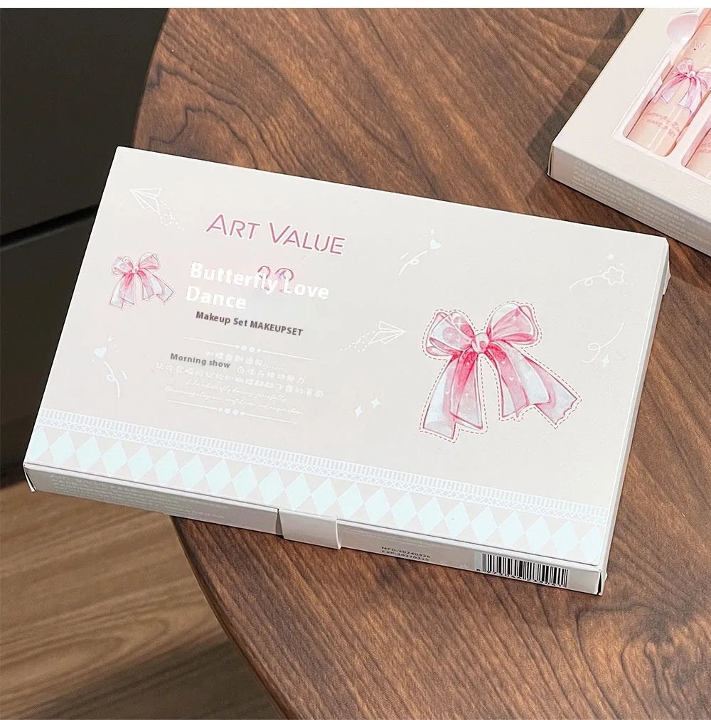 Butterfly Box makeup set containing four pink lip muds, powder blusher and necklace in butterfly packaging