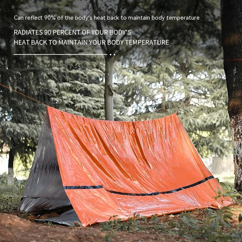 Emergency disaster relief tent kit with orange sleeping bag and whistle survival gear