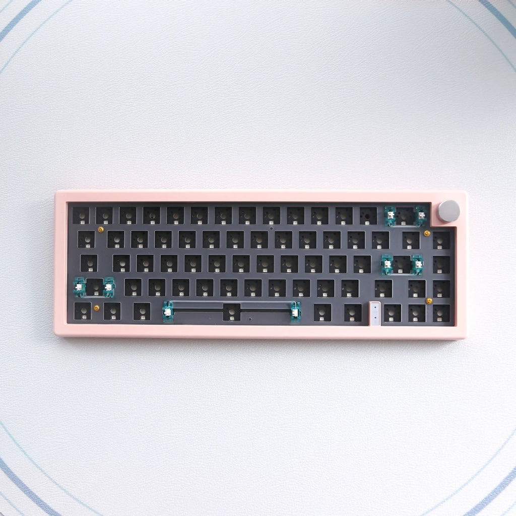 DIY hot-swappable RGB mechanical keyboard kit with ABS chassis, rotary knob, and USB cable in multiple colours.