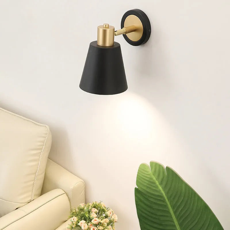 Nordic style iron wall lamp with adjustable arm in bedside setting