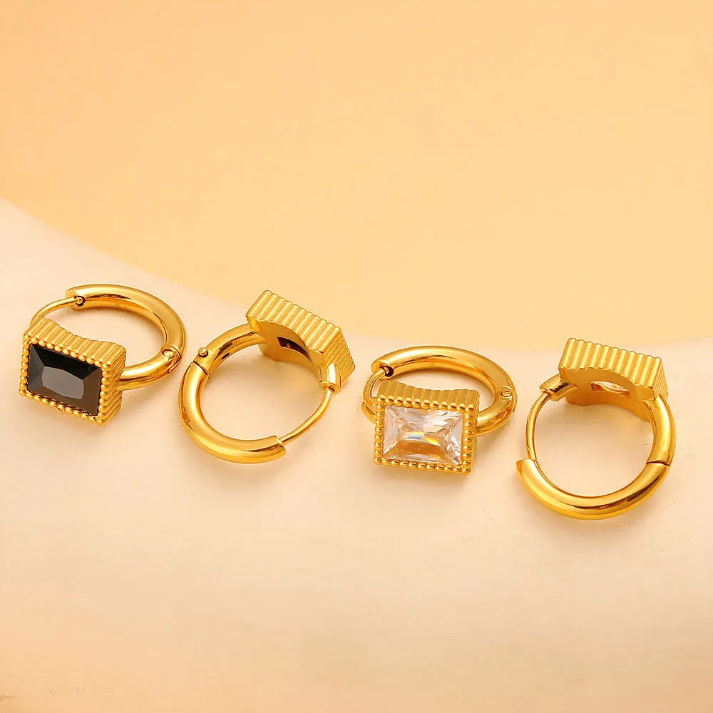 Geometric stainless steel earrings with square zircon stones and ring elements in electroplated colours