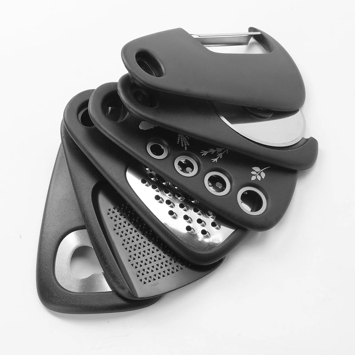 Six kitchen gadgets with brush in stacking configuration showing stainless steel and plastic components