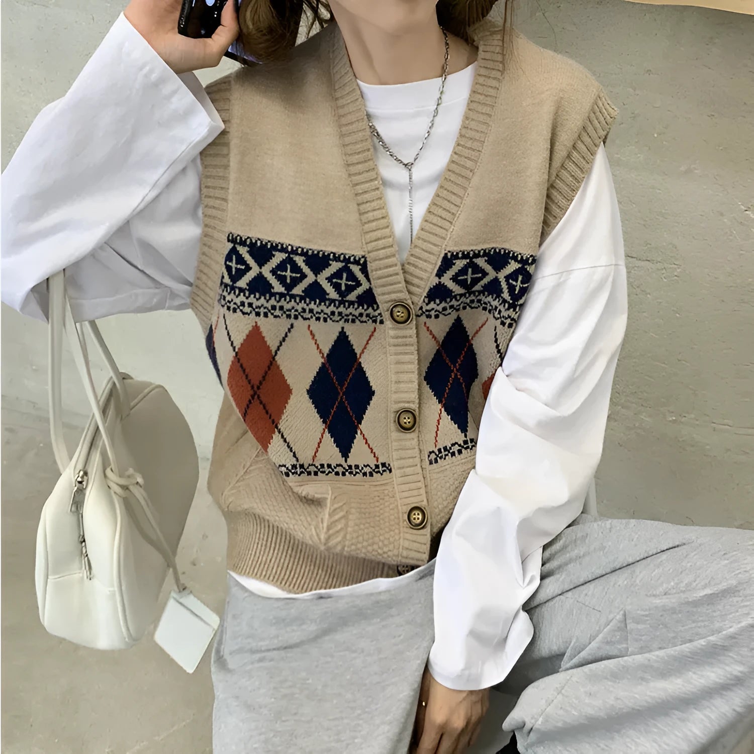 Diamond plaid pattern sleeveless cardigan top in loose fit showing khaki colour option