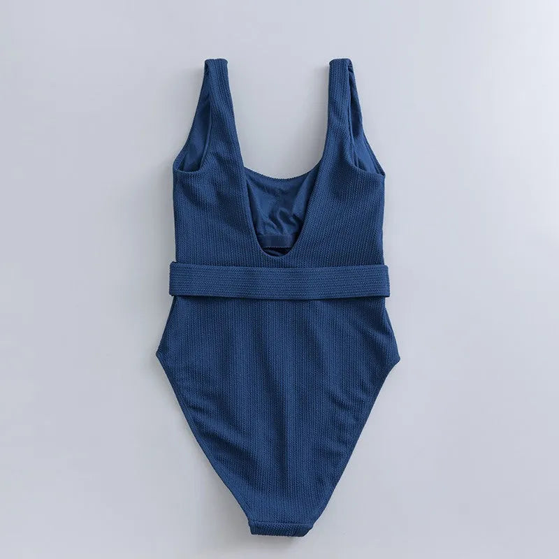 Navy blue women's one-piece slim swimsuit with triangle design and chest pad