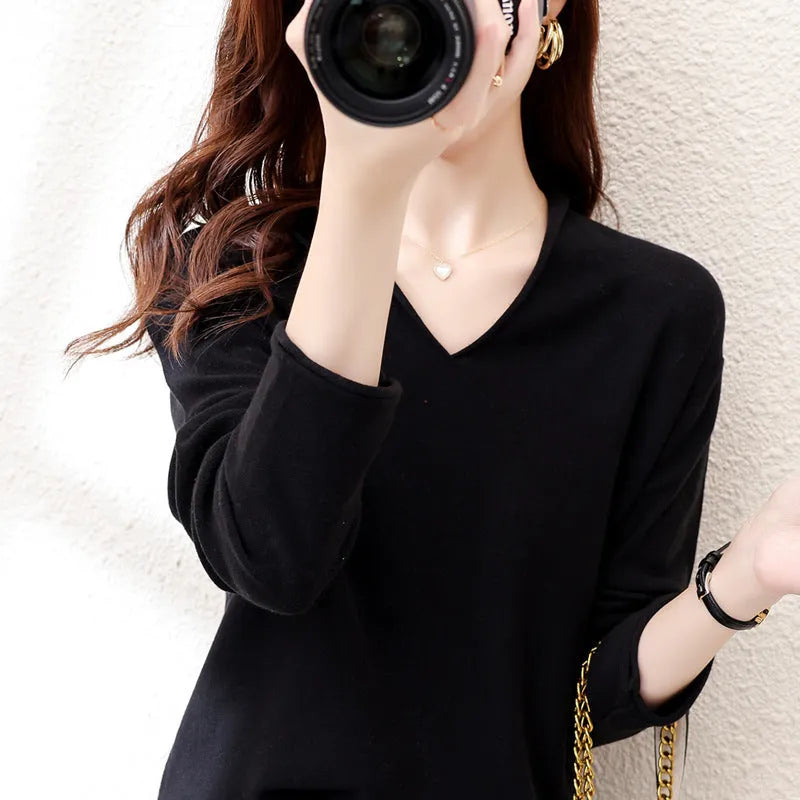 Women's V-neck long sleeve knitwear top in wine red colour, laid flat.