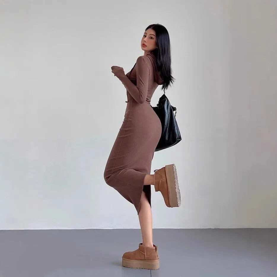 Women's grey hooded long sleeve sheath dress with a high waist and knee-length skirt.