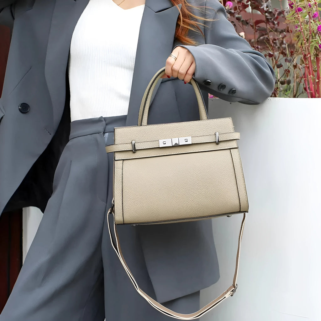 Small square genuine leather shoulder bag in almond green colour showing internal compartments