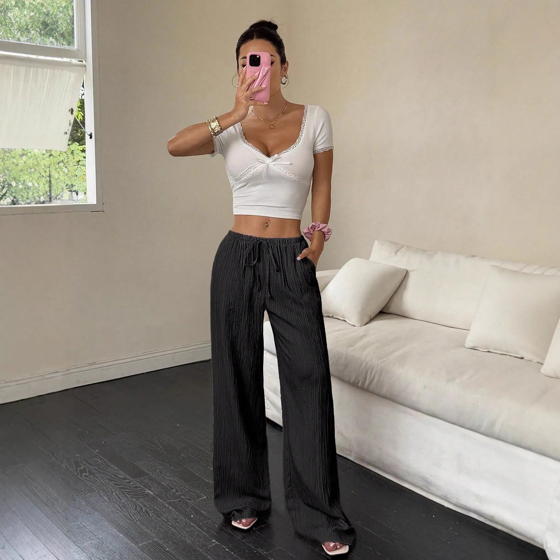 Women's wide leg trousers with lace-up waist detail in black or pink polyester fabric