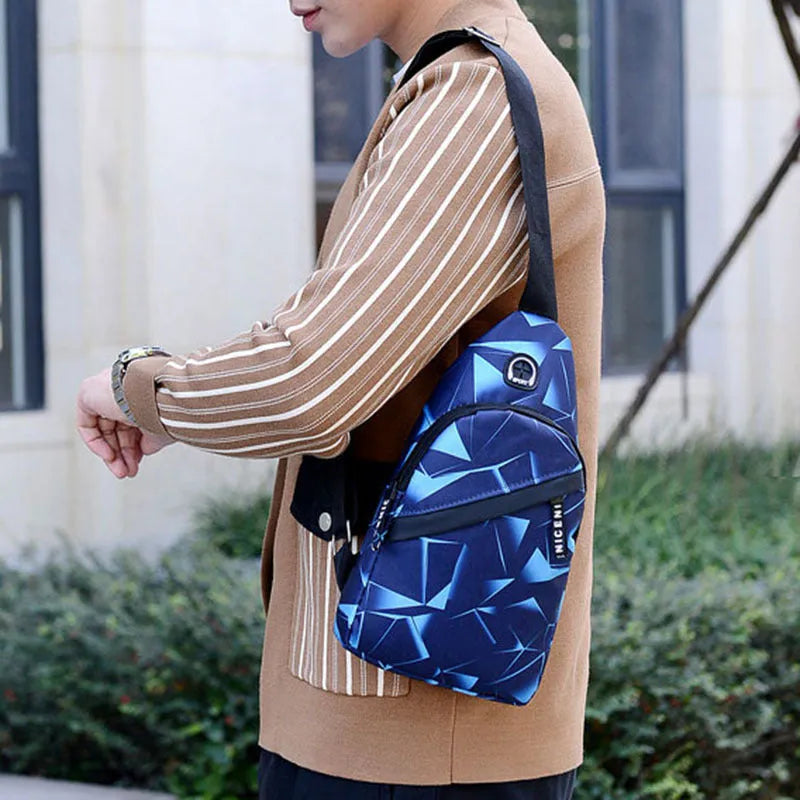 Black Oxford cloth crossbody chest bag for men with a visible earphone hole and zipper.