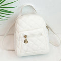 Hard-sided square pink backpack with embroidered detail, shown with soft carry handle and straps.