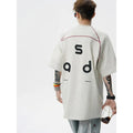 Men's loose fit cotton short-sleeve T-shirt with a printed letter design, shown in available colours.
