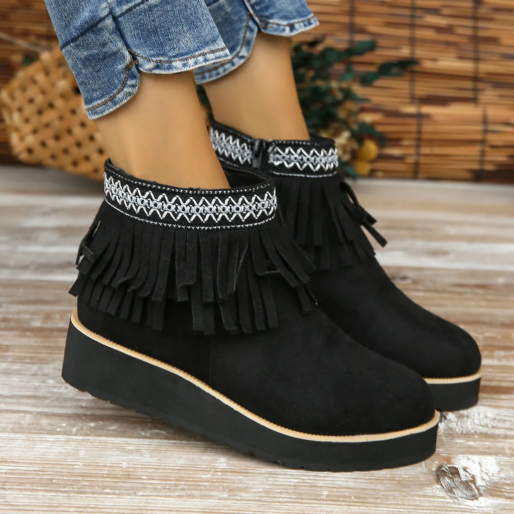 Women's black suede wedge ankle boots with a thick platform sole and side zipper.
