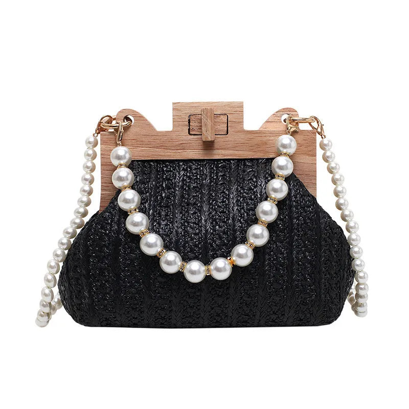 Women's soft straw woven horizontal square shoulder bag with pearl chain strap in beige colour.