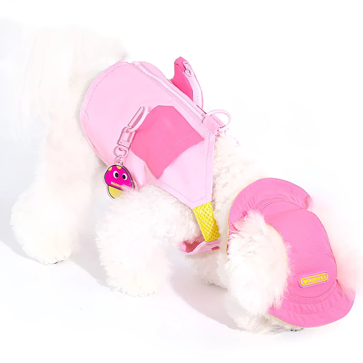 Pink polyester dog vest for small breeds on mannequin showing vest closure
