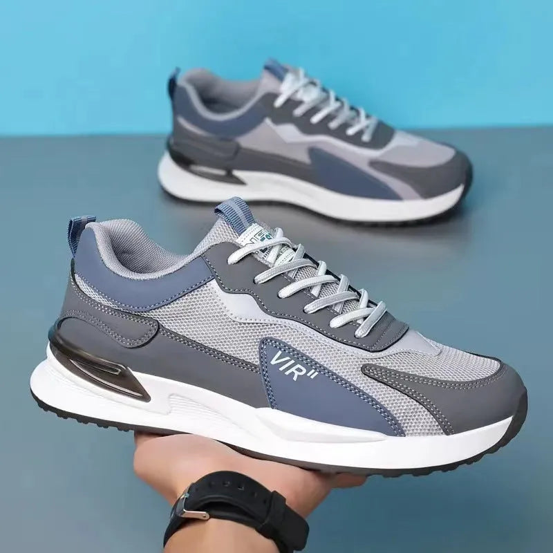 Men's colour block lace-up sneakers in grey with mesh upper and white sole.