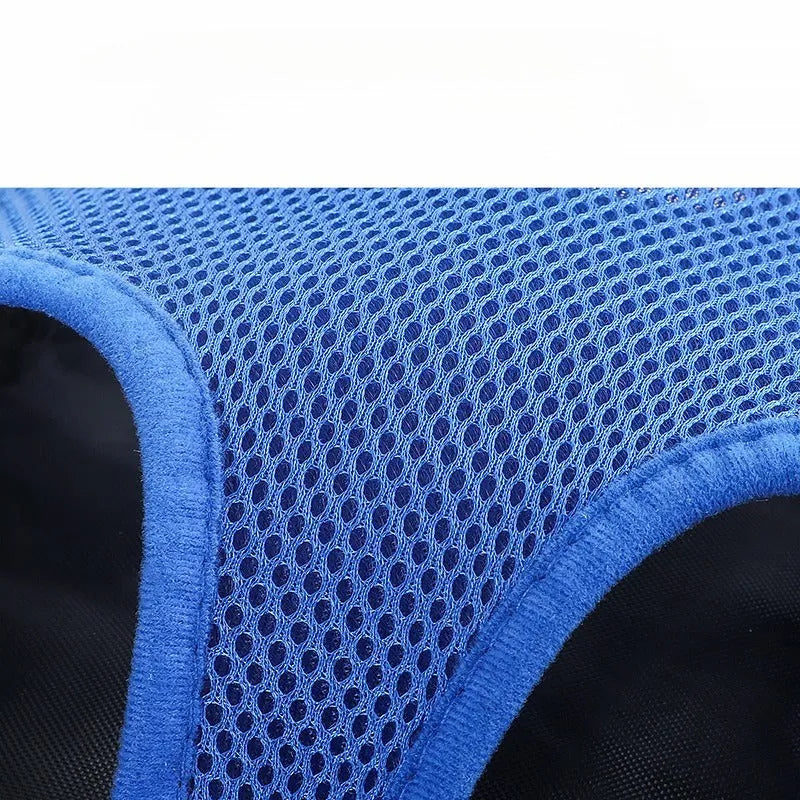 A black adjustable dog carrier backpack worn on a person's back, showing mesh panels and straps, suitable for a small dog.