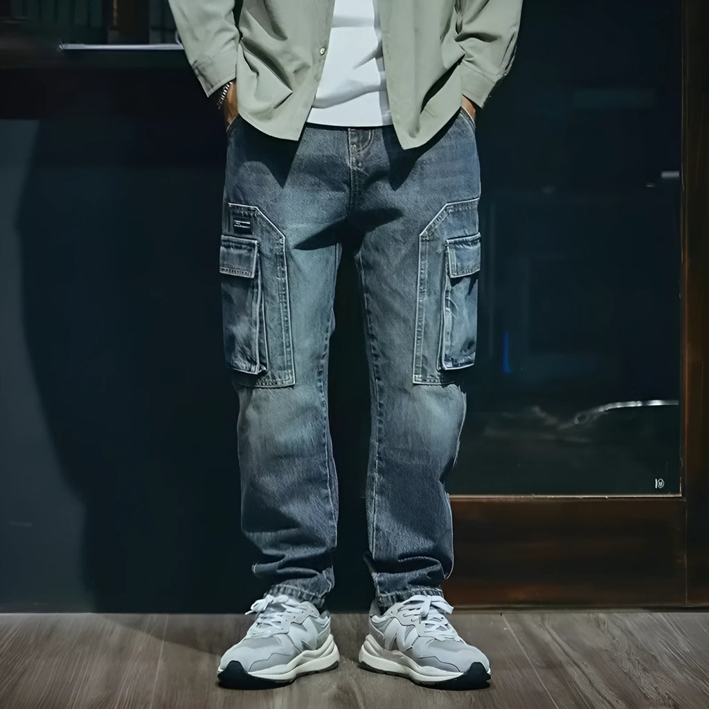 Blue men's loose straight-leg retro jeans with a zip fly, laid flat.