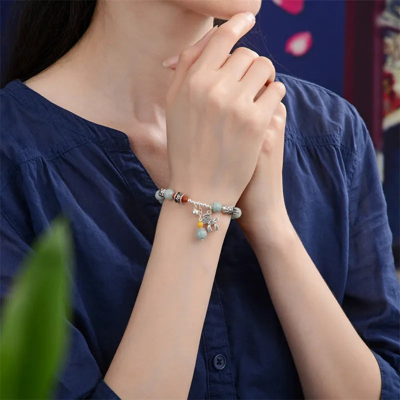 Natural jade vintage bracelet with 8-9mm beads and alloy metal accents on wrist