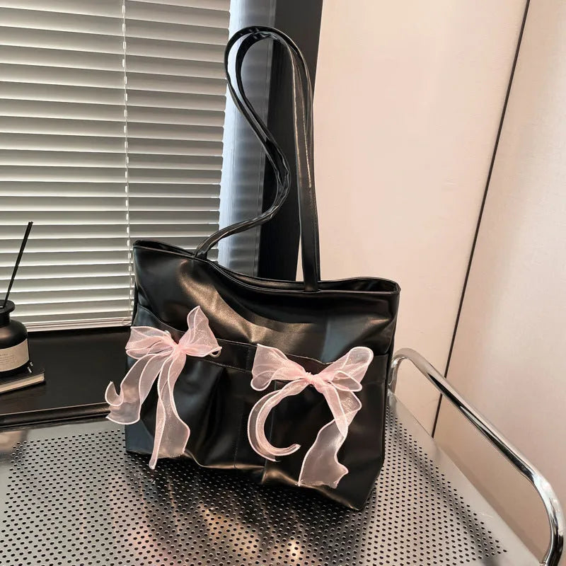 Black college style bow tote bag with large capacity and zipped internal compartments