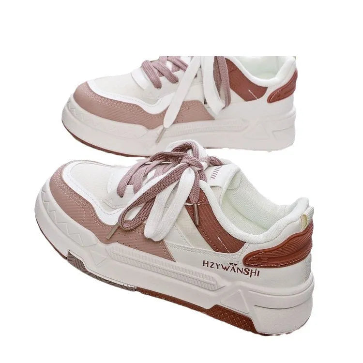 Children's beige board shoes with thick rubber sole, cross shoulder straps, and lace-up front.