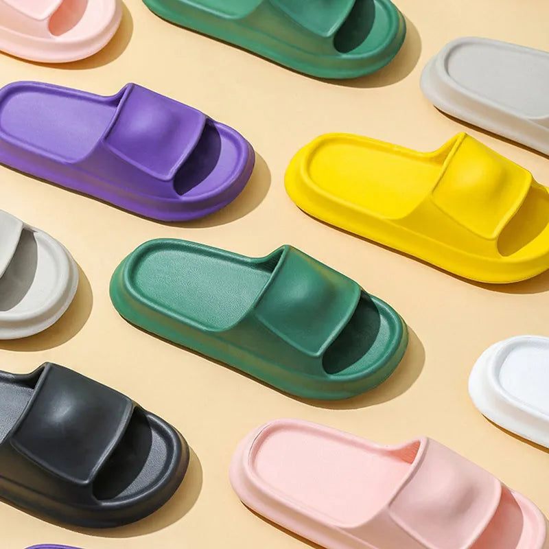 Thick-soled EVA flip-flop slippers in various colours on a white background.