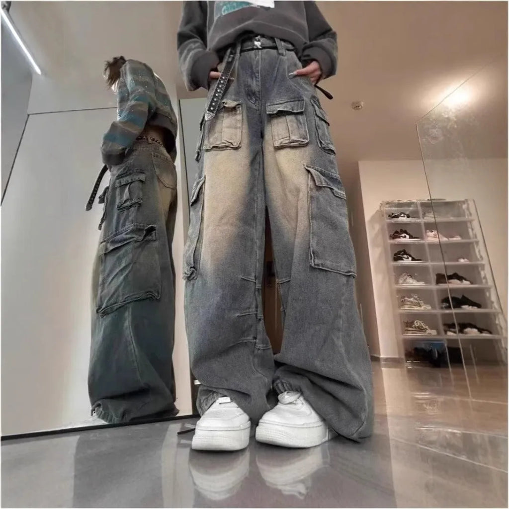 Light blue loose fit multi-pocket distressed jeans with straight leg cut and tooling style design